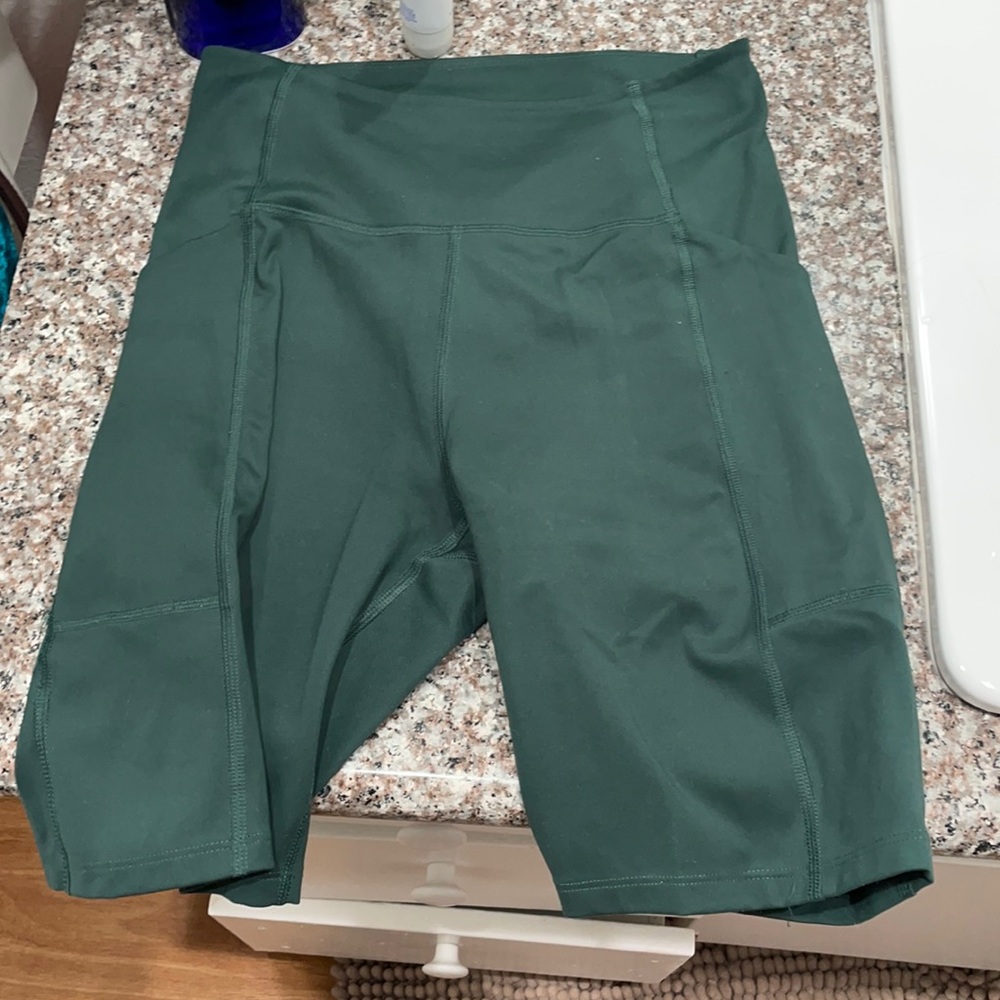 Green girlfriend collective bike shorts